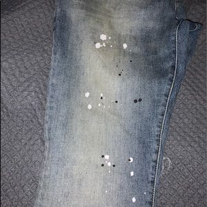 Purple denim paint splatter jeans